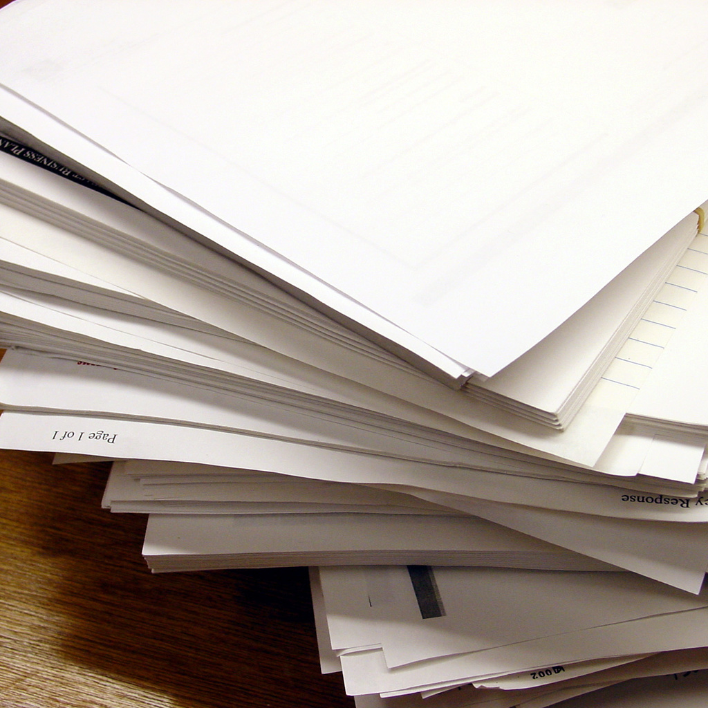 A stack of paper reports.